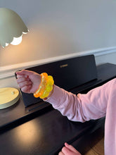 Load image into Gallery viewer, orange Feelzies™ Original Squishy Bracelet: Sunburst Orange fidget
